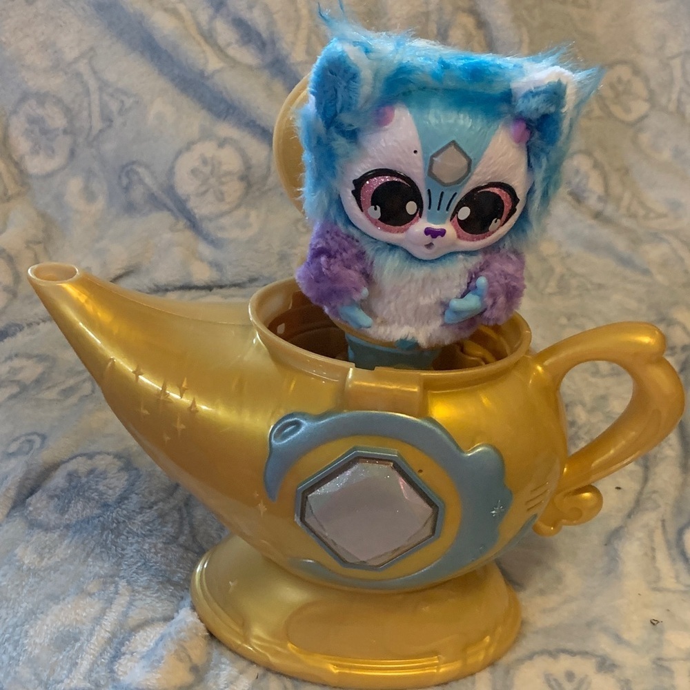 Whimsical Genie Lamp with Blue and Purple Plush Toy